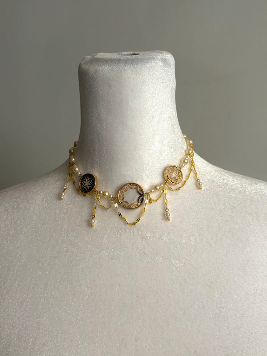 Seashell Pendants with Pearl Beads and Dangling Details on a Gold Choker Necklace