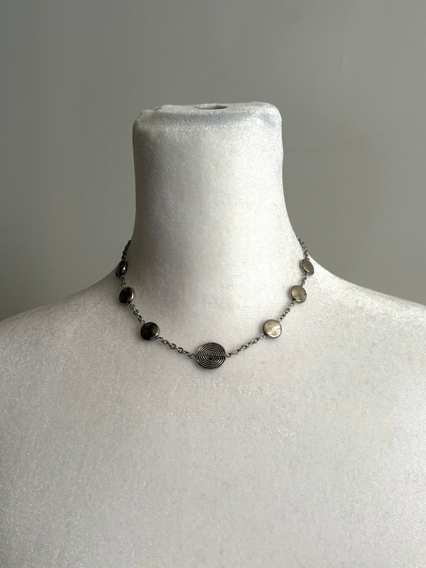 Simple Circular Beads on a Short Silver Necklace