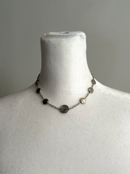 Simple Circular Beads on a Short Silver Necklace