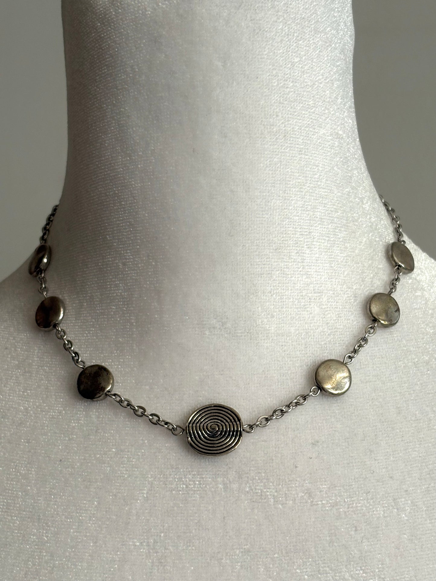 Simple Circular Beads on a Short Silver Necklace
